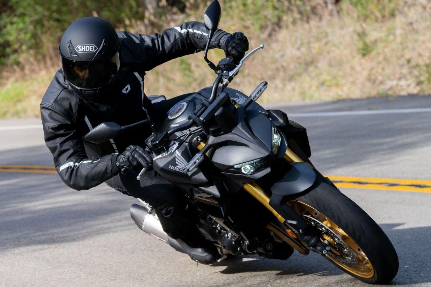 Sport motorcycle rider wearing performance riding gear
